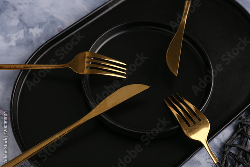 Plate with golden forks and...