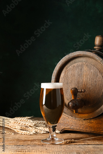 Wooden barrel and glass of ...