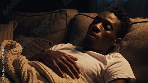 Relaxed Man Asleep on Sofa, Resting in Comfort, Peaceful Scene at Home