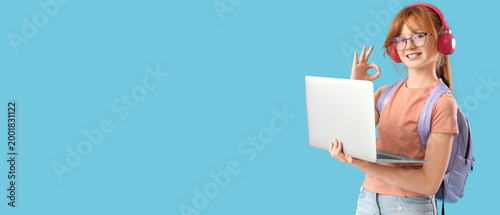 Cute schoolgirl with modern...