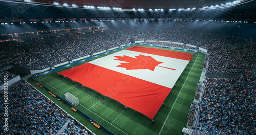 фотографія Professional Stadium Soccer Game Championship With Flag of Canada Spread Across the Pitch Before Football Match Start