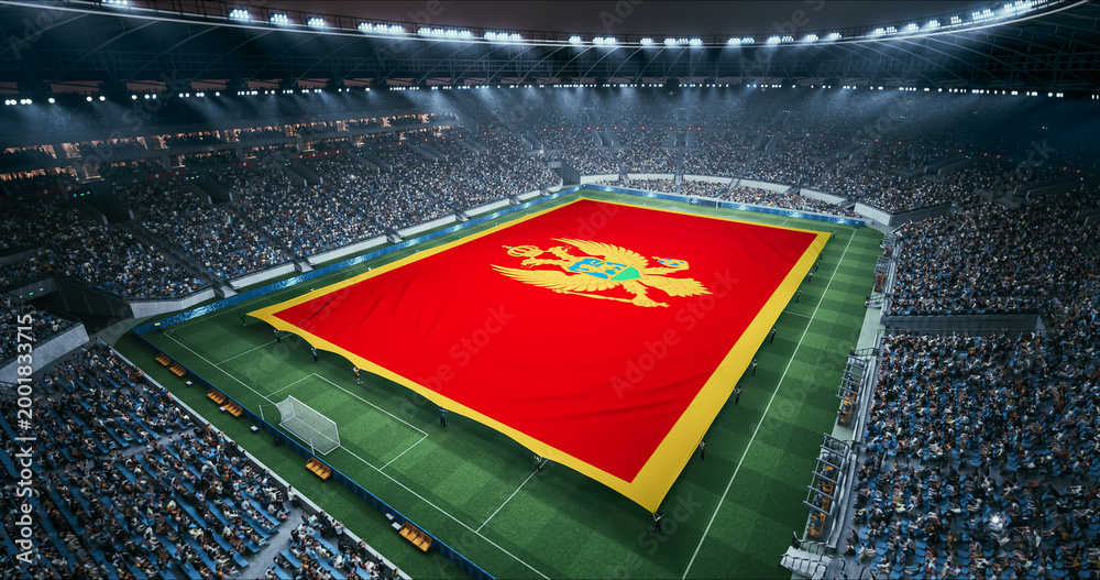 Naklejka premium Professional Stadium Soccer Game Championship With Flag of Montenegro Spread Across the Pitch Before Football Match Start. Cheering Crowds of Fans Surround the Field. Aerial Wide Shot