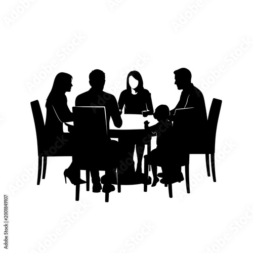 Family gathered around a table in silhouette.