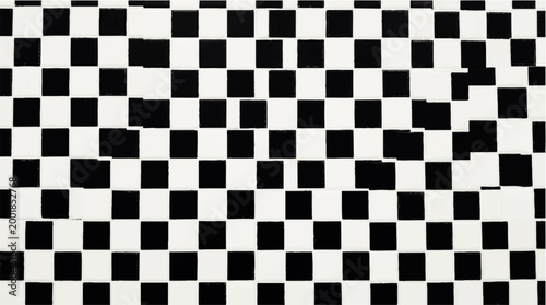 Abstract checkered pattern of black and white squares creating a visually striking and modern geometric design
