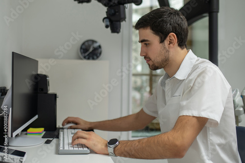 Dentist working at computer