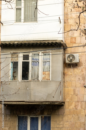 air conditioner, condenser unit, compressor on facade of building. unit of central AC conditioner of HVAC heating ventilation system. Indoor and office air cooling during seasonal temperature rise.