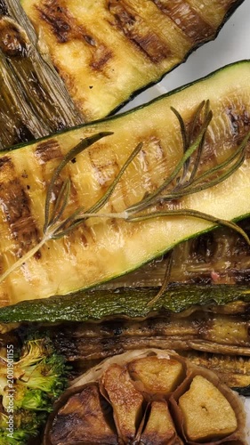 grilled vegetables in a white plate on a wooden background. Delicious healthy vegetarian snack. Healthly food