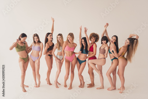 Slika na platnu Group of diverse young women in colorful underwear celebrating body positivity,