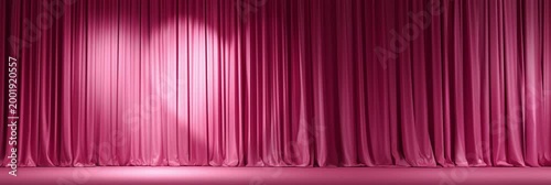 Elegant pink curtains drape gracefully, inviting anticipation for a performance.