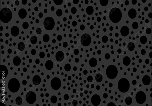Obraz na plátně An abstract pattern featuring black circles of various sizes scattered across a dark charcoal grey background, creating a textured, polka-dot aesthetic with a modern, minimalist feel