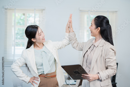 Asian woman succeeds at office