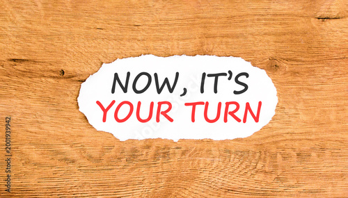 Now it's your turn words symbol. Concept words Now it's your turn on beautiful white paper. Beautiful wooden background. Business Now it's your turn motivational support concept. Copy space.