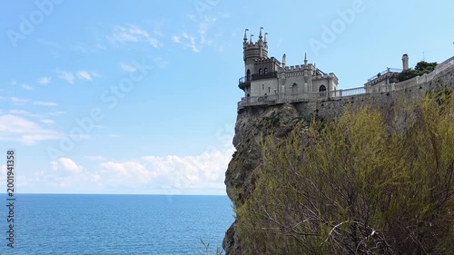 Swallow's nest castle is a famous architectural landmark. A neo-gothic structure defying gravity on aurora cliff. Offering breathtaking panoramic views of the tranquil black sea under a clear blue sky