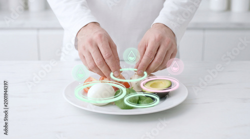 Chef arranging food presentation with colorful sauces on plate  