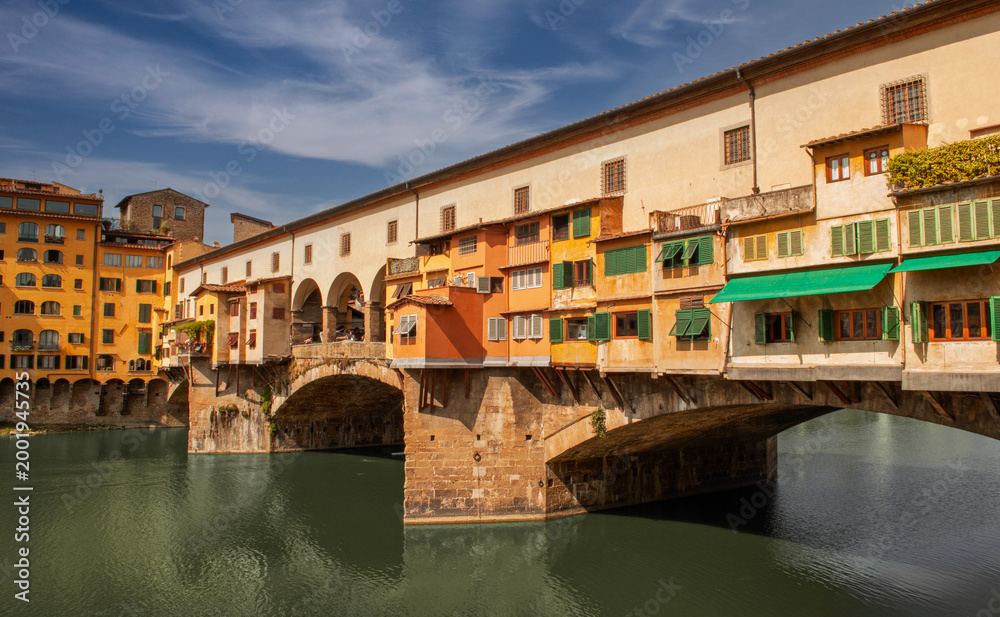 Naklejka premium Ponte Vecchio in Florence, the oldest stone bridge in Europe, rebuilt in its current form in 1345