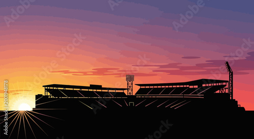 Dramatic silhouette of a large sports stadium with light towers against a vibrant sunset sky, showcasing a majestic atmosphere.