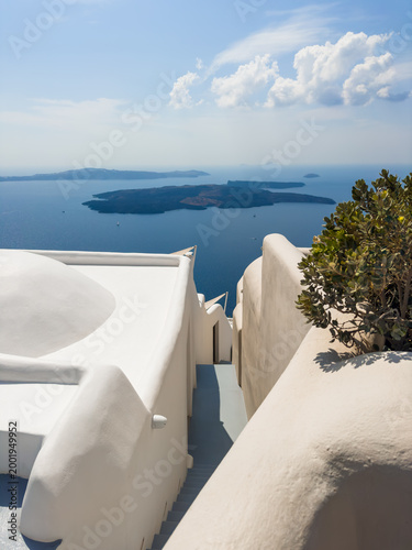 White architecture in Santorini island, Greece. Beautiful seascape at sunny day. Travel and summer vacation concept
