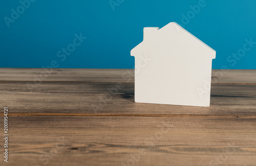 White house on wood table. ...