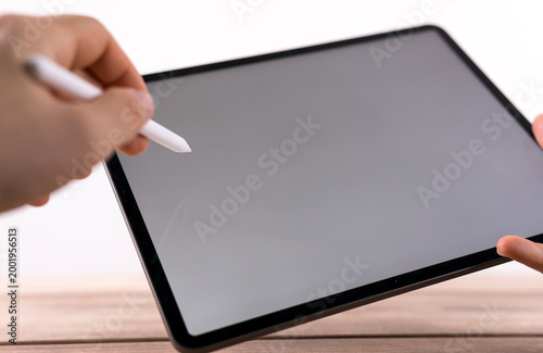 Person using a tablet and s...