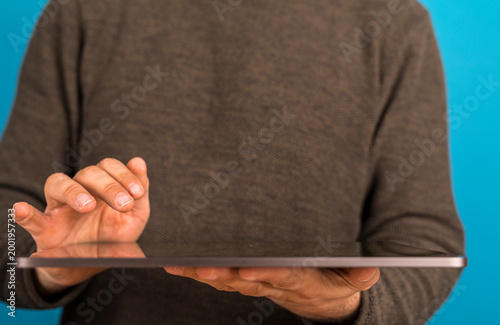 Person holding a digital ta...