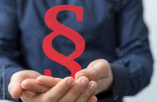 Hand holding red paragraph ...