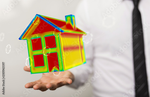 Businessman holding a 3D mo...