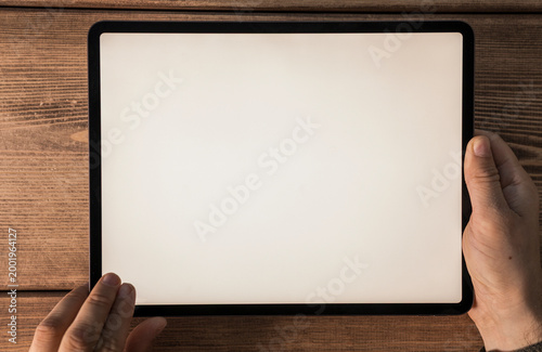 Close-up of hands holding a...