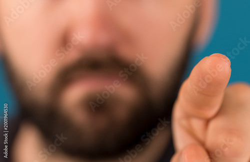 Close up shot of a man poin...