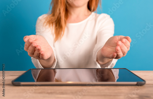 Woman presenting something ...