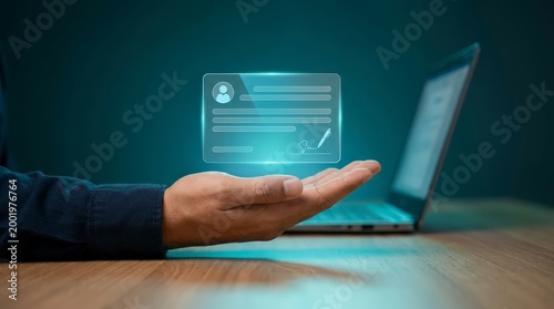 Hand Holding Glowing Digital Identity Card Profile Icon Above Desk With Laptop