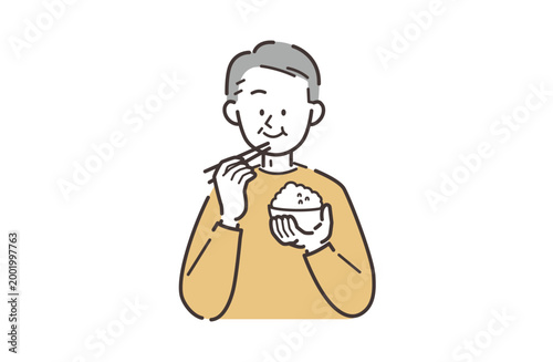 食事をするシニア男性