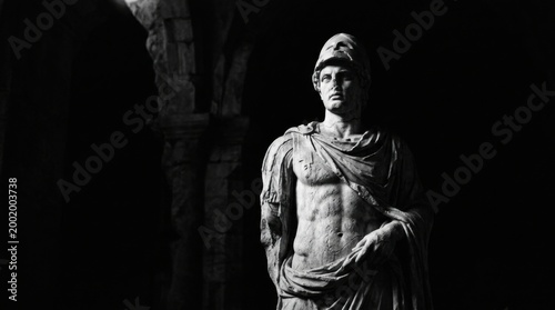 Roman warrior imperial marble sculpture with helmet in ancient setting