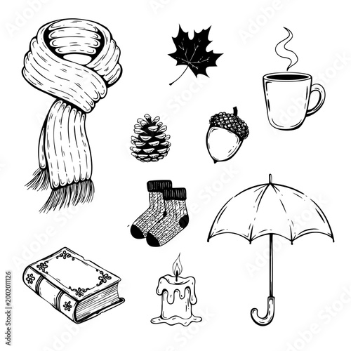 Black vector illustration of coziness with a steaming mug, a candle, an acorn, and wool socks in autumn