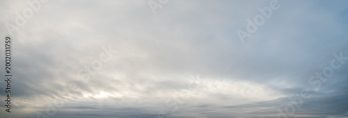 Clouds in the overcast evening sky view.