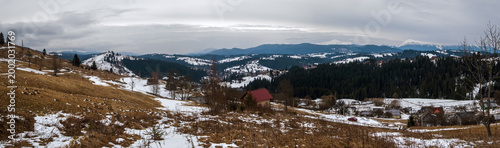 Winter evening overcast twilight mountains (Ukraine, Carpathians -  mountain peaks scenery view from Yablunytsia village outskirts).