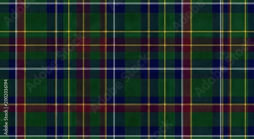 A traditional tartan pattern in deep green, navy blue, and dark red with thin white and yellow accents, creating a classic woven textile design