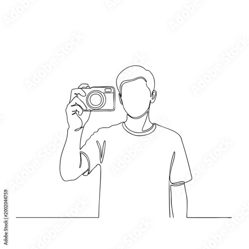 Continuous line drawing of young man holding camera and taking selfie or photograph with modern digital photo equipment.