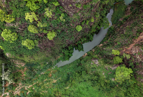 A river flowing through lush greenery on Reunion Island from an aerial perspective