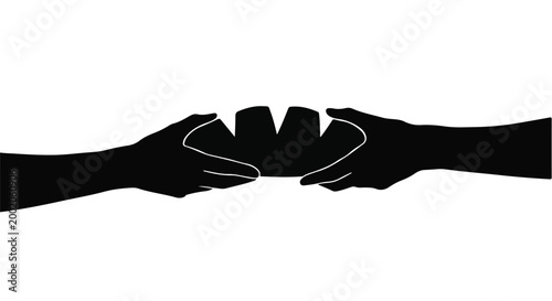 Hands pass a piece of fresh bread between two people in a sharing gesture.