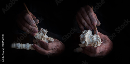 Craftsman hand works to create Tobacco pipe from meerschaum