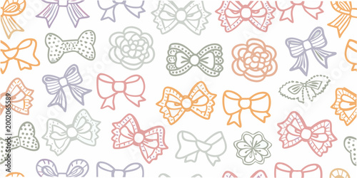 Repeating pattern of pastel colored bows and floral shapes