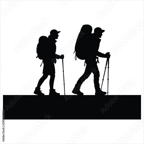 Silhouette of two hikers with backpacks and trekking poles