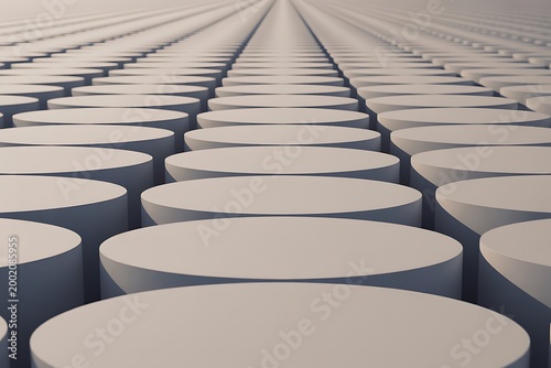 Rows of grey round platforms creating a geometric pattern with infinite perspective