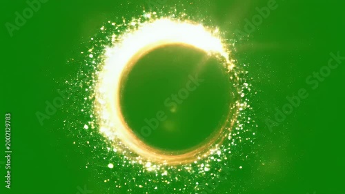 A vibrant golden spiral of shimmering particles gracefully swirls against a solid green background, creating a dynamic and captivating visual effect.