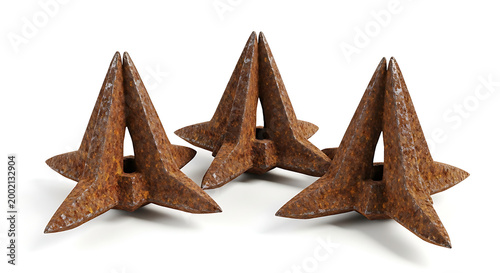 Three rusty caltrops isolated on a white background for security or defense concepts