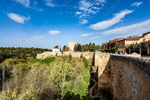 The area within the city walls around the castles and churches of the fortified city of Segovia in Spain on a spring weekday