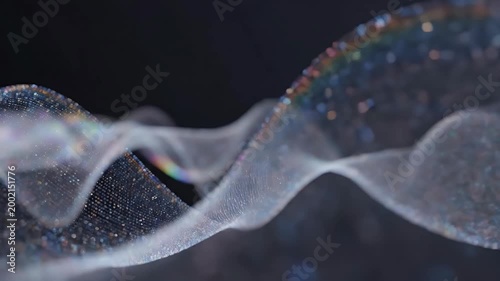 A shimmering, iridescent abstract form floats against a dark background, creating a captivating visual effect of light and movement.