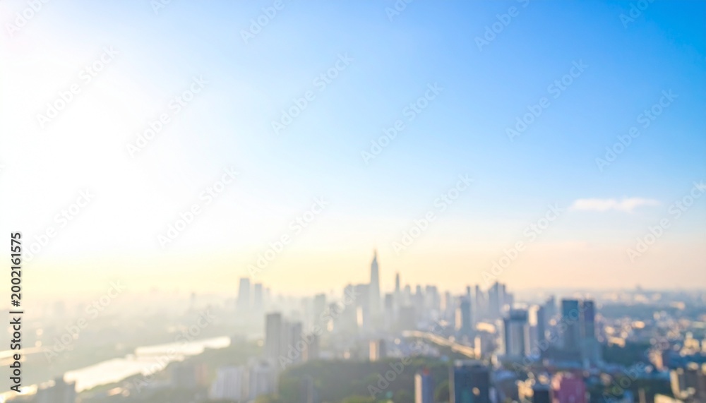 Fototapeta premium 青空の下の都市景観 ぼやけた写真のイメージ画像