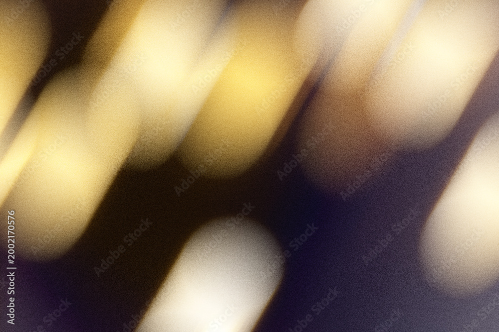 Fototapeta premium Abstract motion blur background creating warm golden light streaks and atmospheric glow
