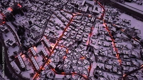Snowy Chamonix France town lights at night winter aerial perspective